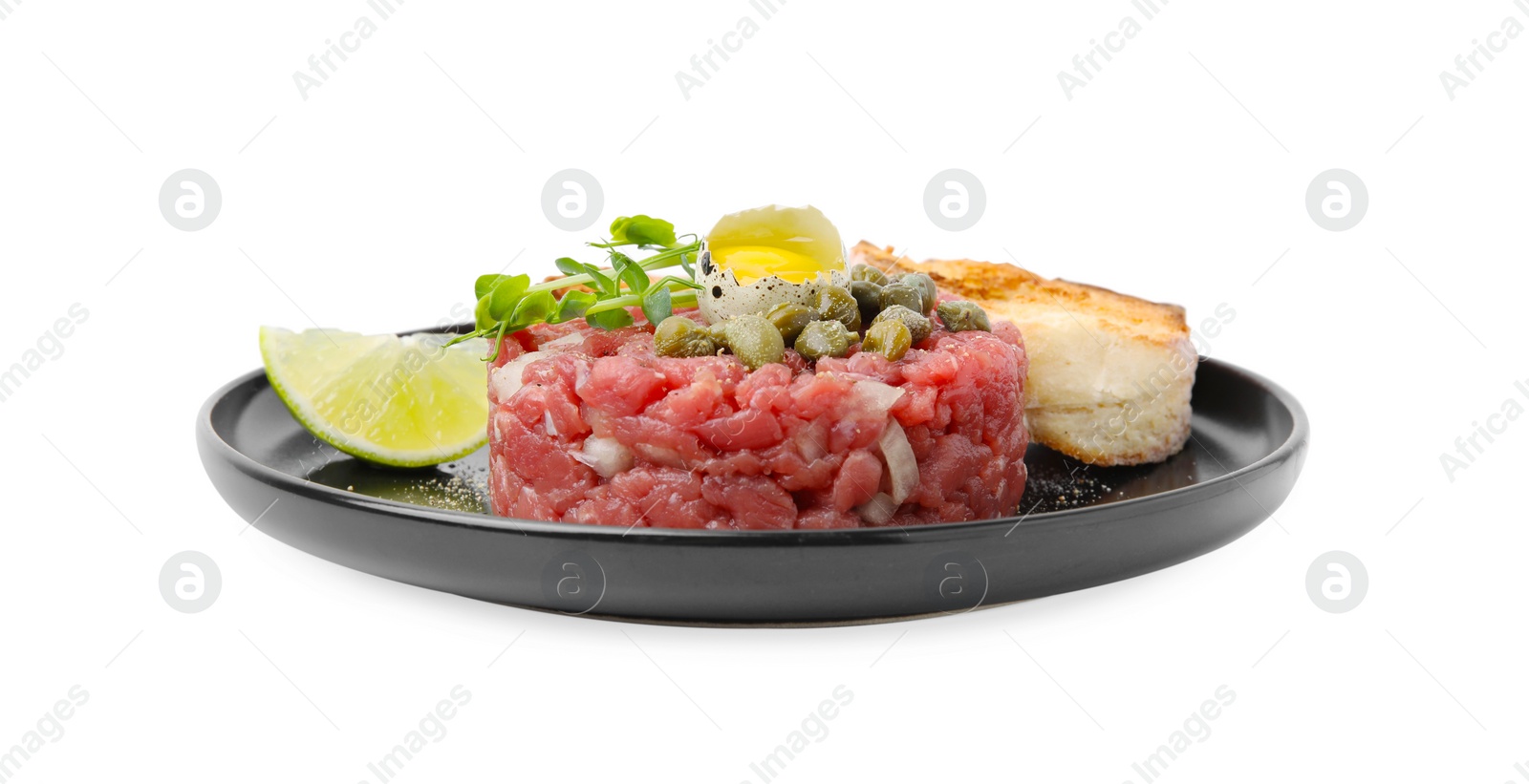 Photo of Tasty beef steak tartare served with quail egg, toasted bread and other accompaniments isolated on white