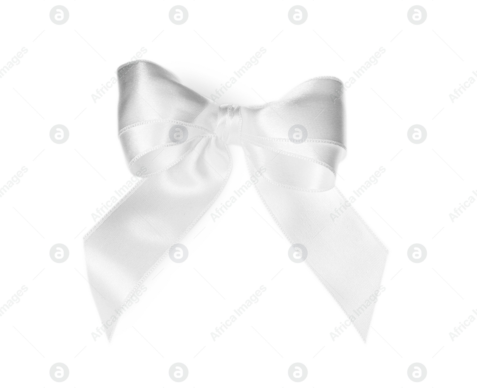 Photo of Satin ribbon tied in bow on white background, top view