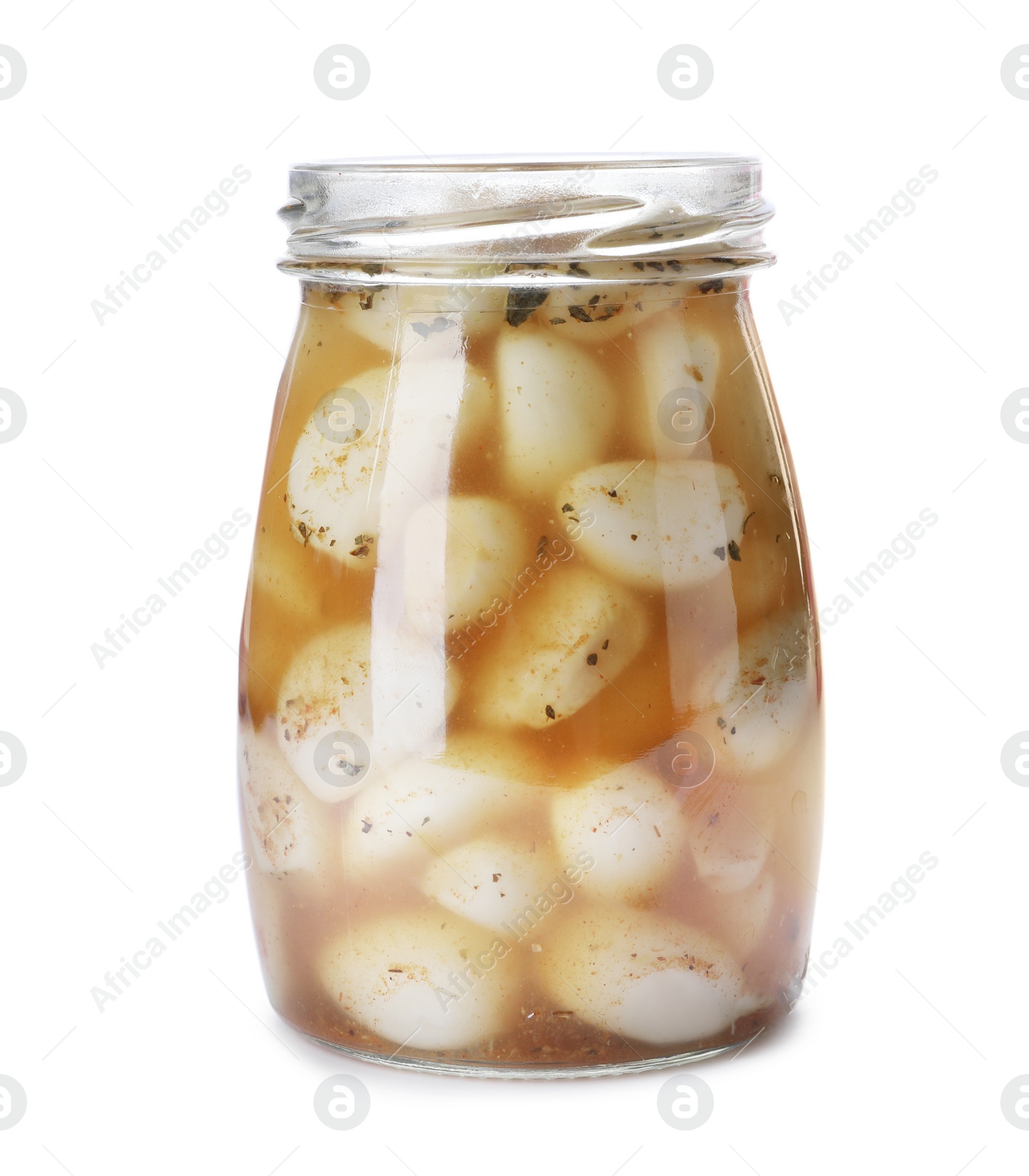 Photo of Glass jar with preserved garlic on white background