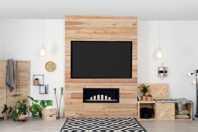 Photo of Living room interior with modern TV on wooden wall