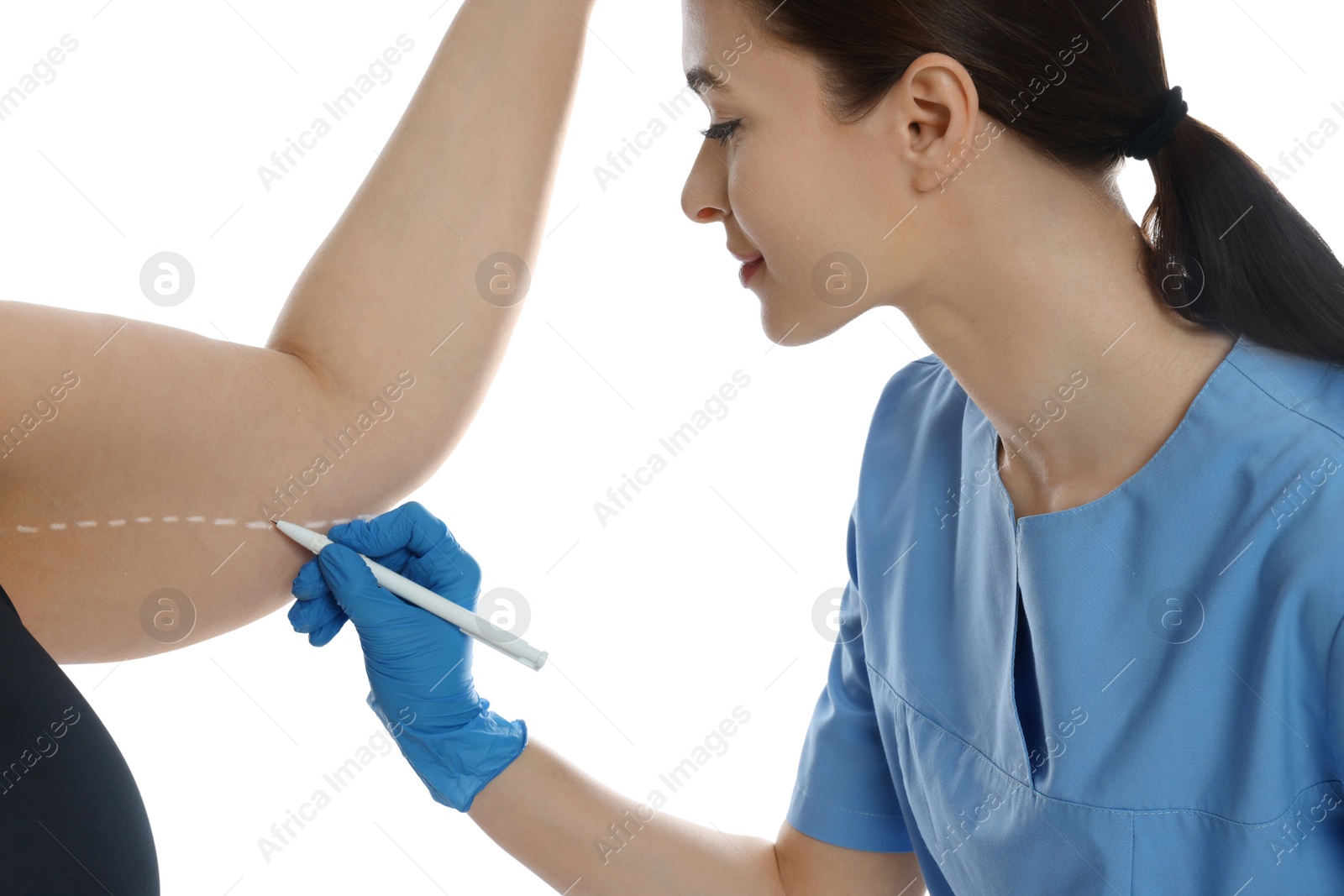 Photo of Doctor drawing marks on obese woman's body against white background. Weight loss surgery