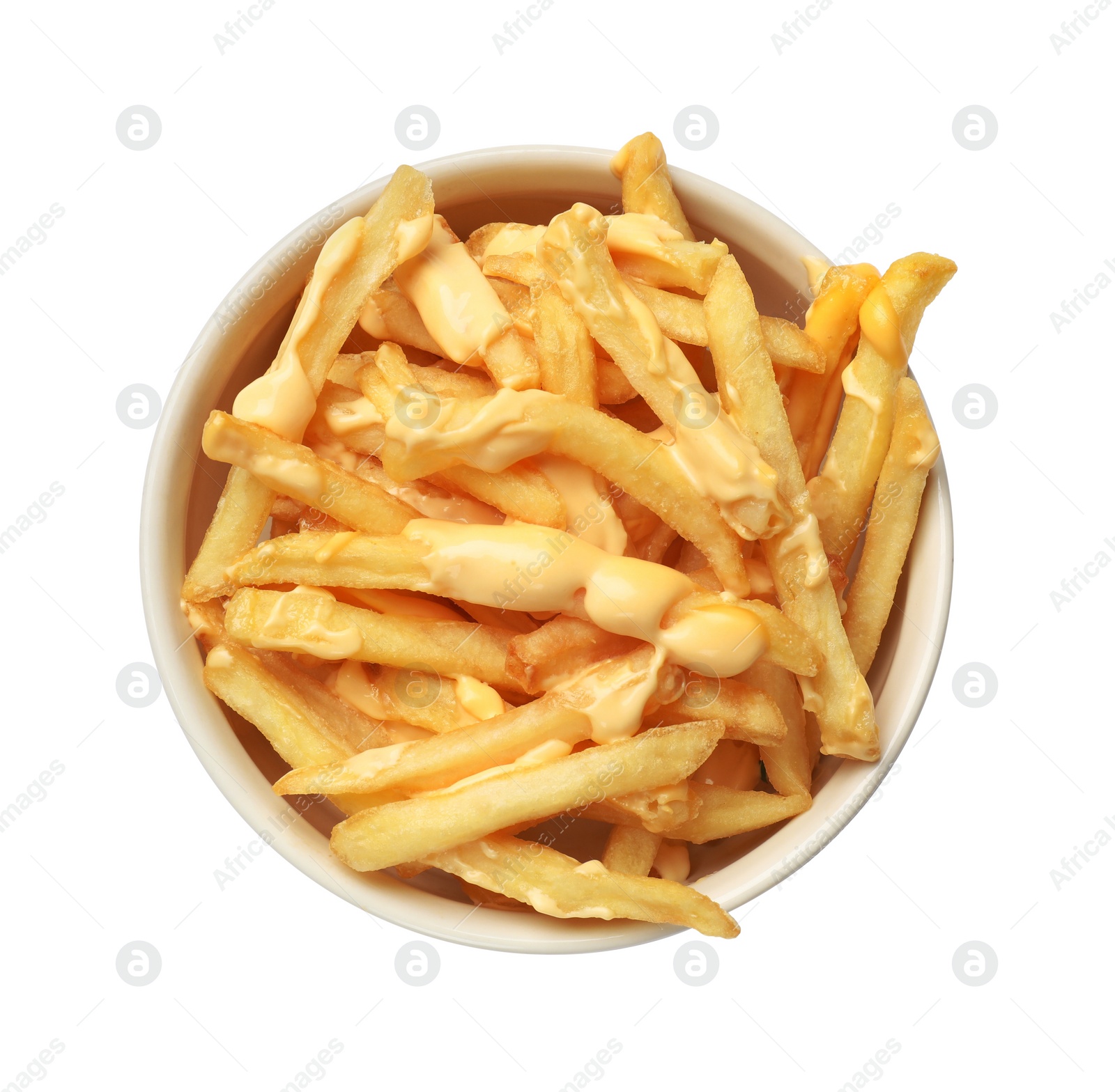 Photo of Delicious french fries with cheese sauce in bowl isolated on white, top view