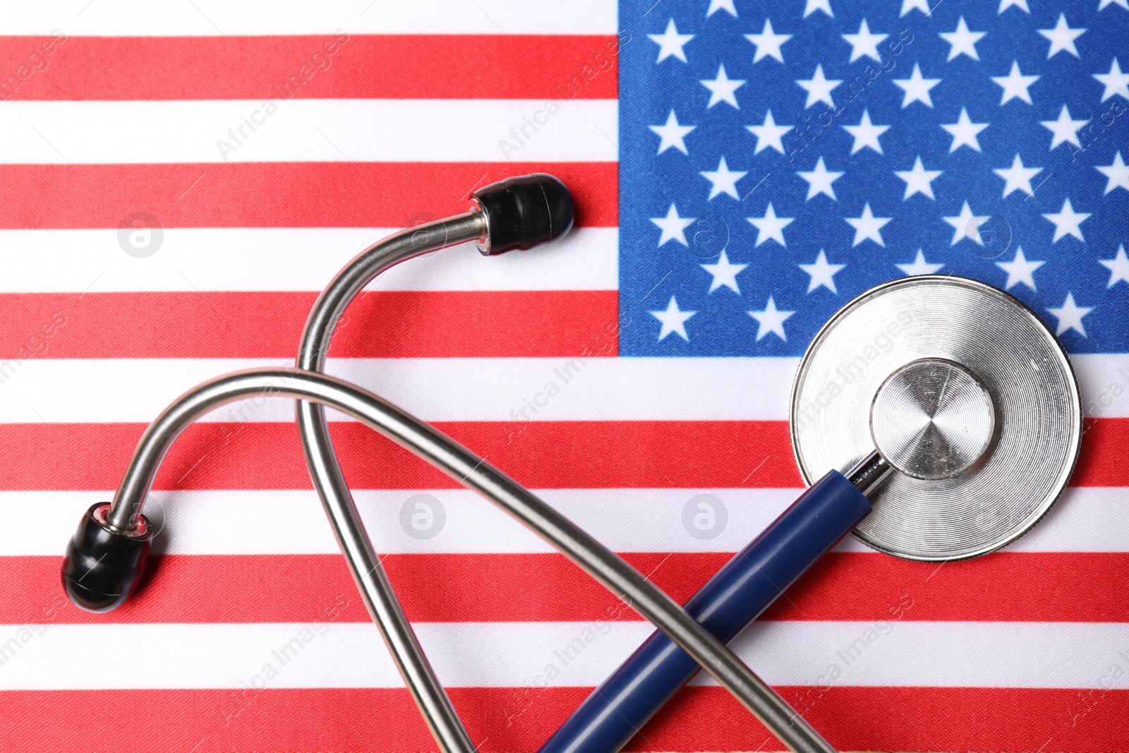 Photo of Stethoscope on USA flag, top view. Health care concept