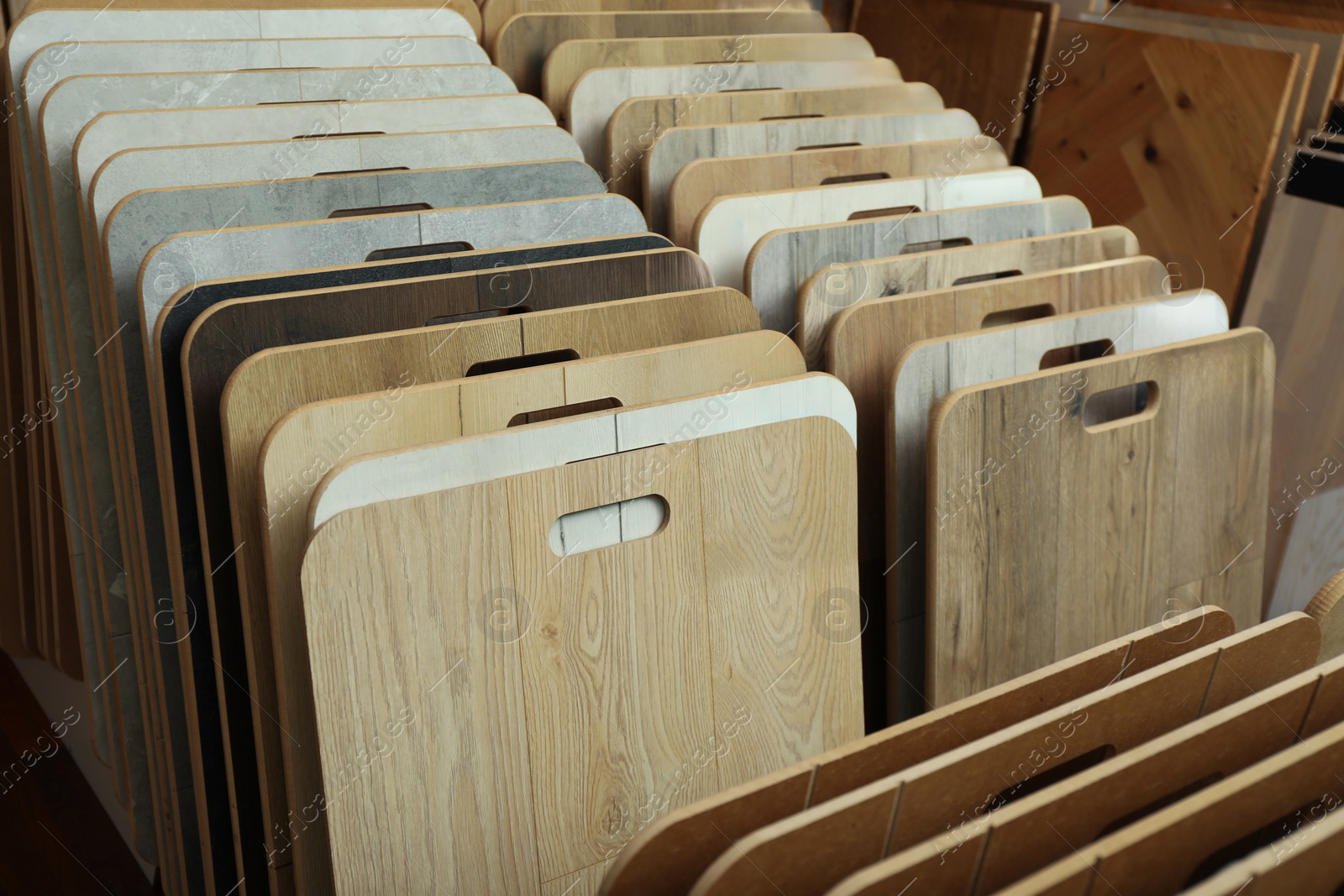 Photo of Many different samples of wooden flooring in store