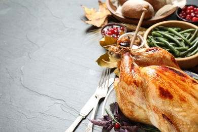Photo of Composition with turkey on grey background, space for text. Happy Thanksgiving day