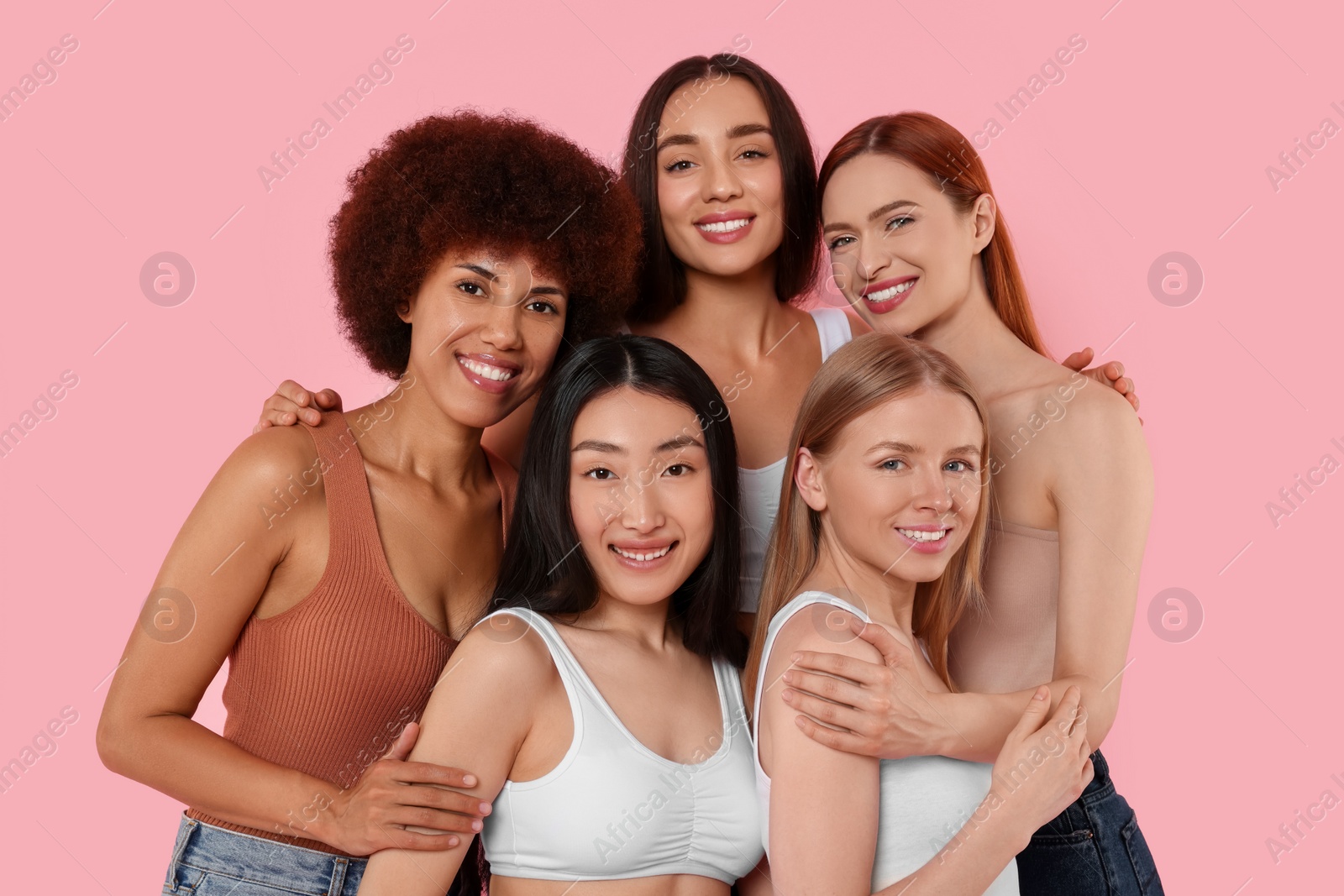 Photo of Portrait of beautiful young women on pink background