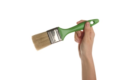 Woman holding paint brush on white background, closeup