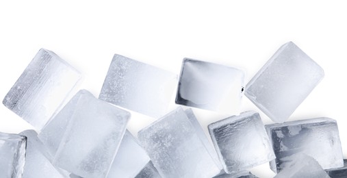 Many clear ice cubes on white background, top view