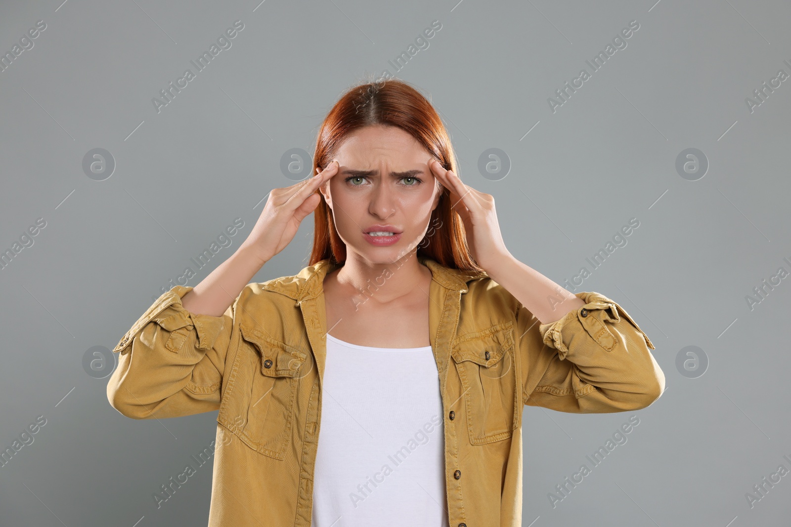 Photo of Casting call. Emotional woman performing on grey background