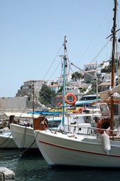 Photo of Beautiful view of coastal city with different boats on sunny day