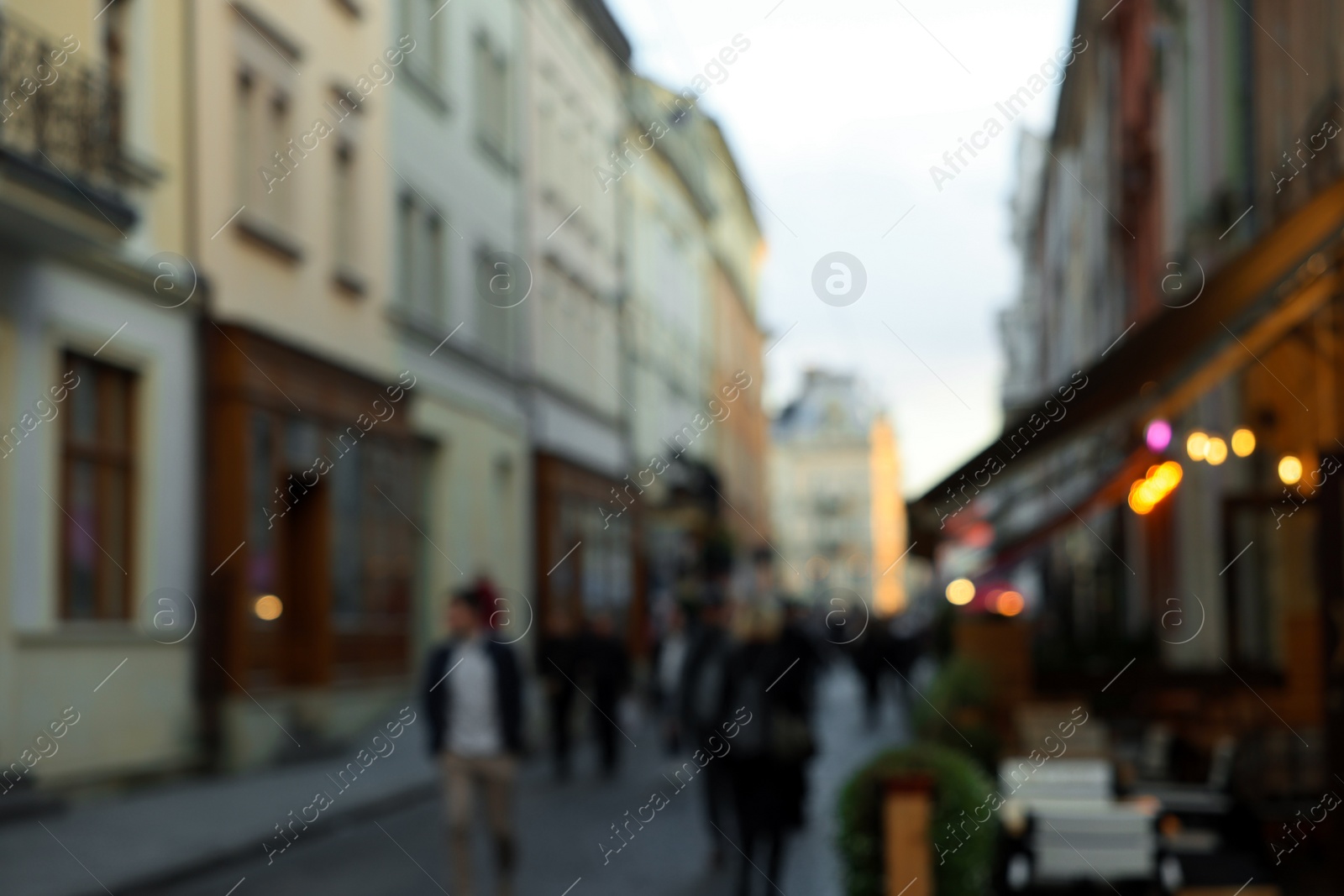 Photo of Blurred view of people walking on city street