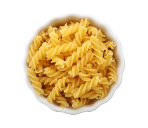 Bowl with uncooked fusilli pasta on white background, top view