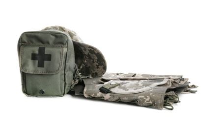 Military clothes and first-aid kit on white background
