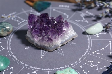 Photo of Astrology prediction. Zodiac wheel and different gemstones, closeup