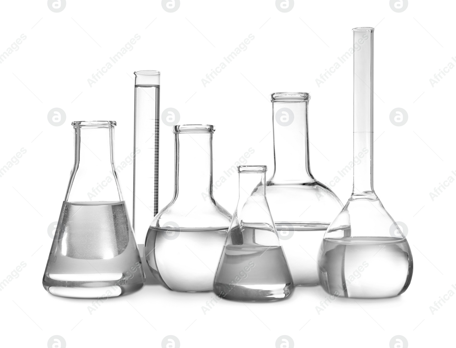 Photo of Glassware with liquids isolated on white. Laboratory analysis