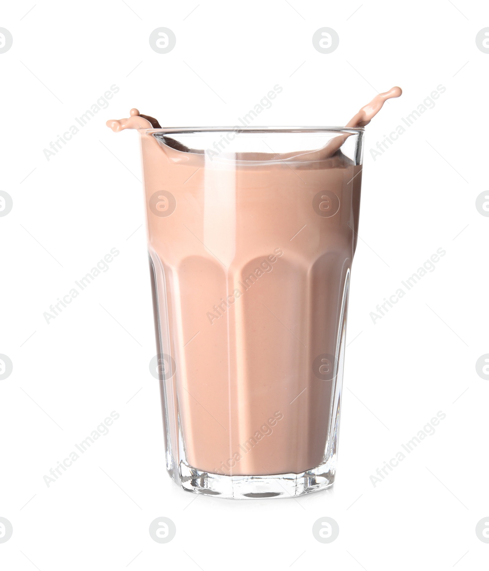 Photo of Glass with splashing chocolate milk on white background. Dairy drink