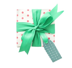 Photo of Christmas gift box with green bow and tag on isolated white, top view