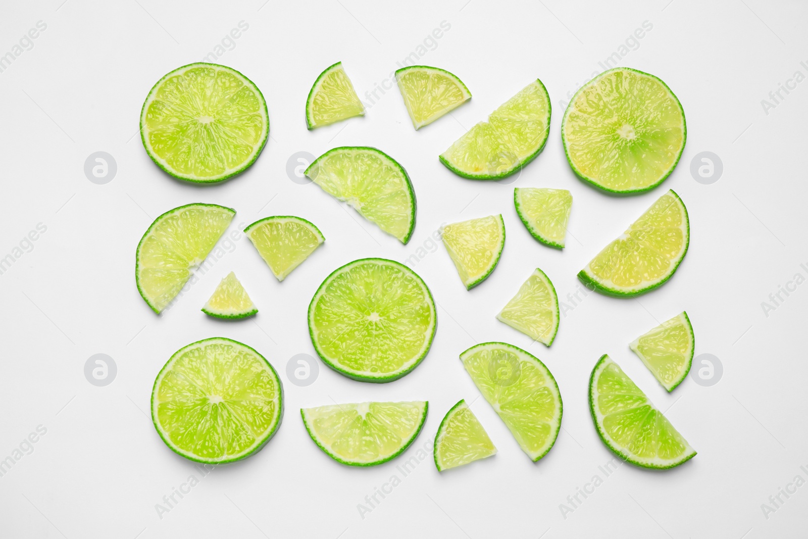 Photo of Juicy fresh lime slices on white background, top view