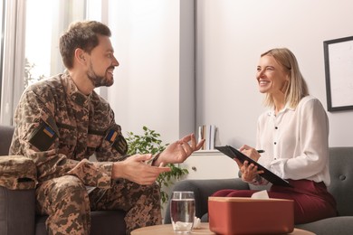 Psychologist working with military officer in office