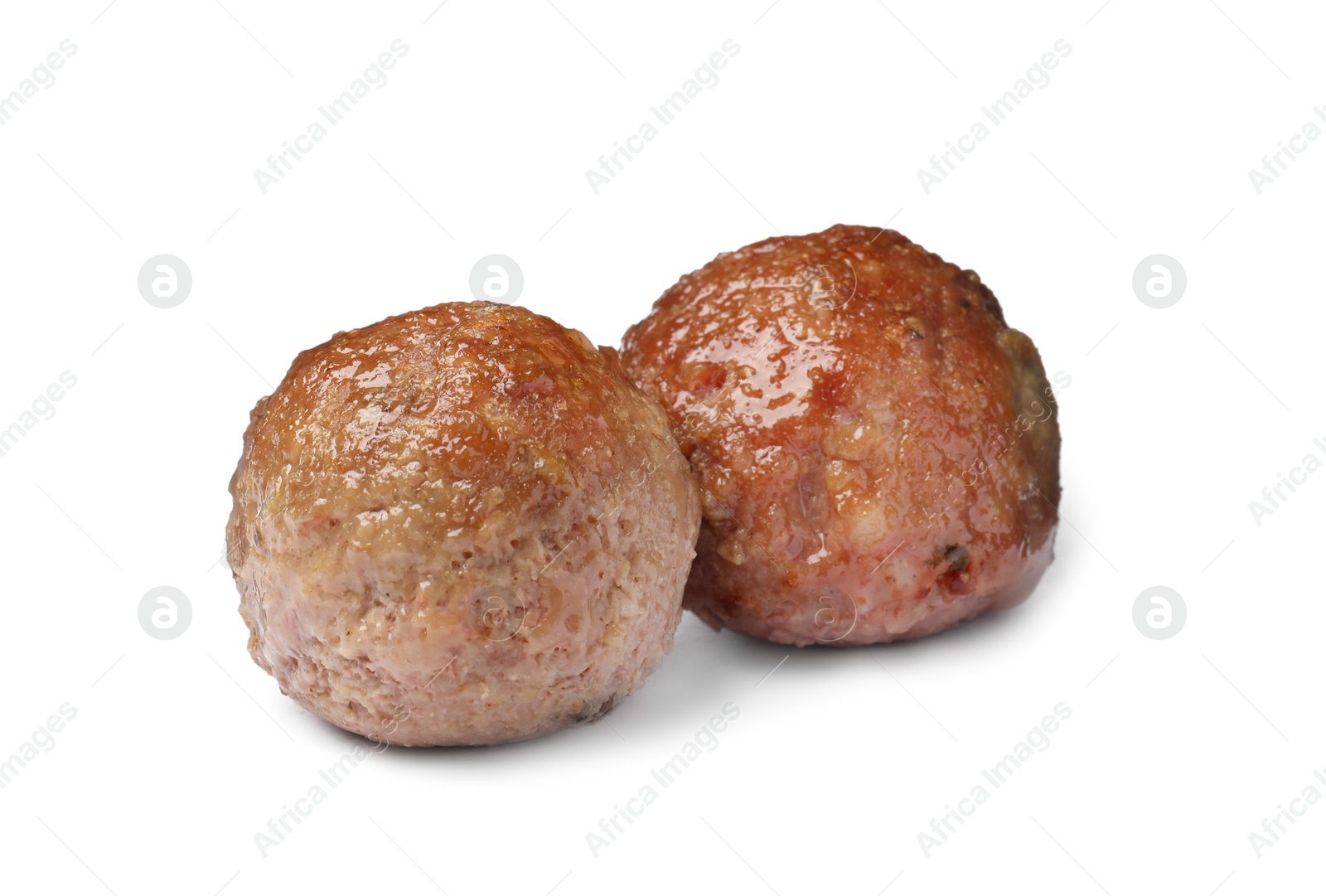 Photo of Two tasty cooked meatballs on white background