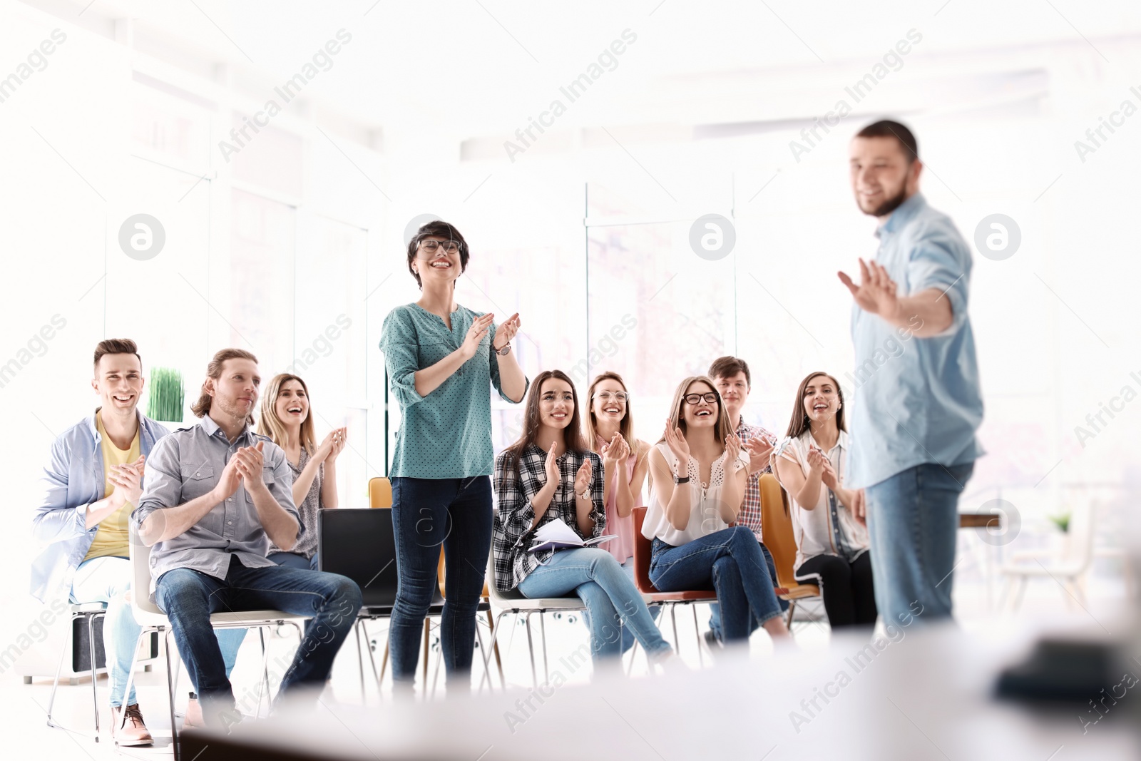 Photo of Male business trainer giving lecture in office