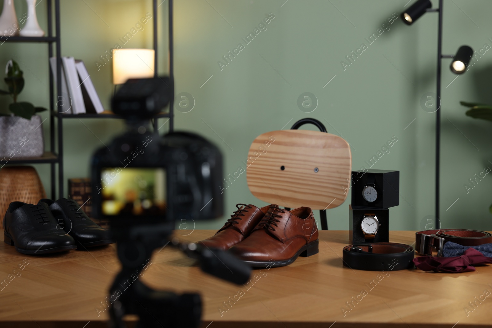 Photo of Beauty blogger's workplace. Men's accessories on table indoors