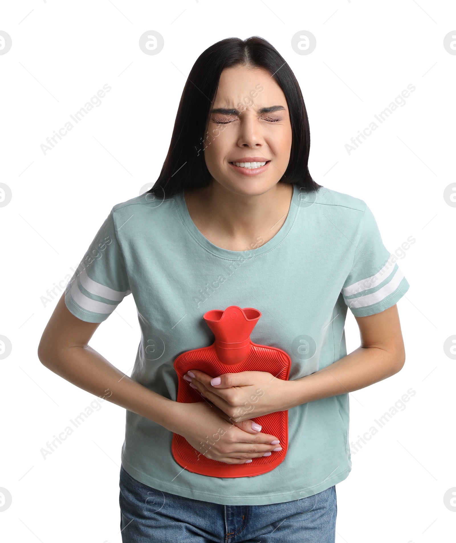 Photo of Woman using hot water bottle to relieve abdominal pain on white background