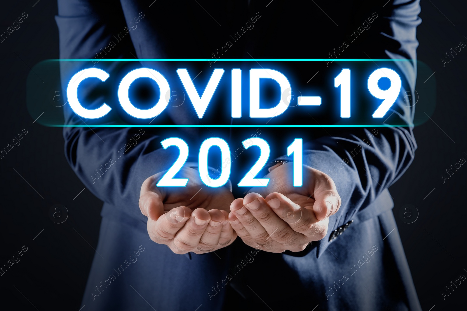 Image of COVID-19 predictions for 2021 year. Man and text on dark background, closeup