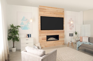 Photo of Living room interior with modern TV on wooden wall