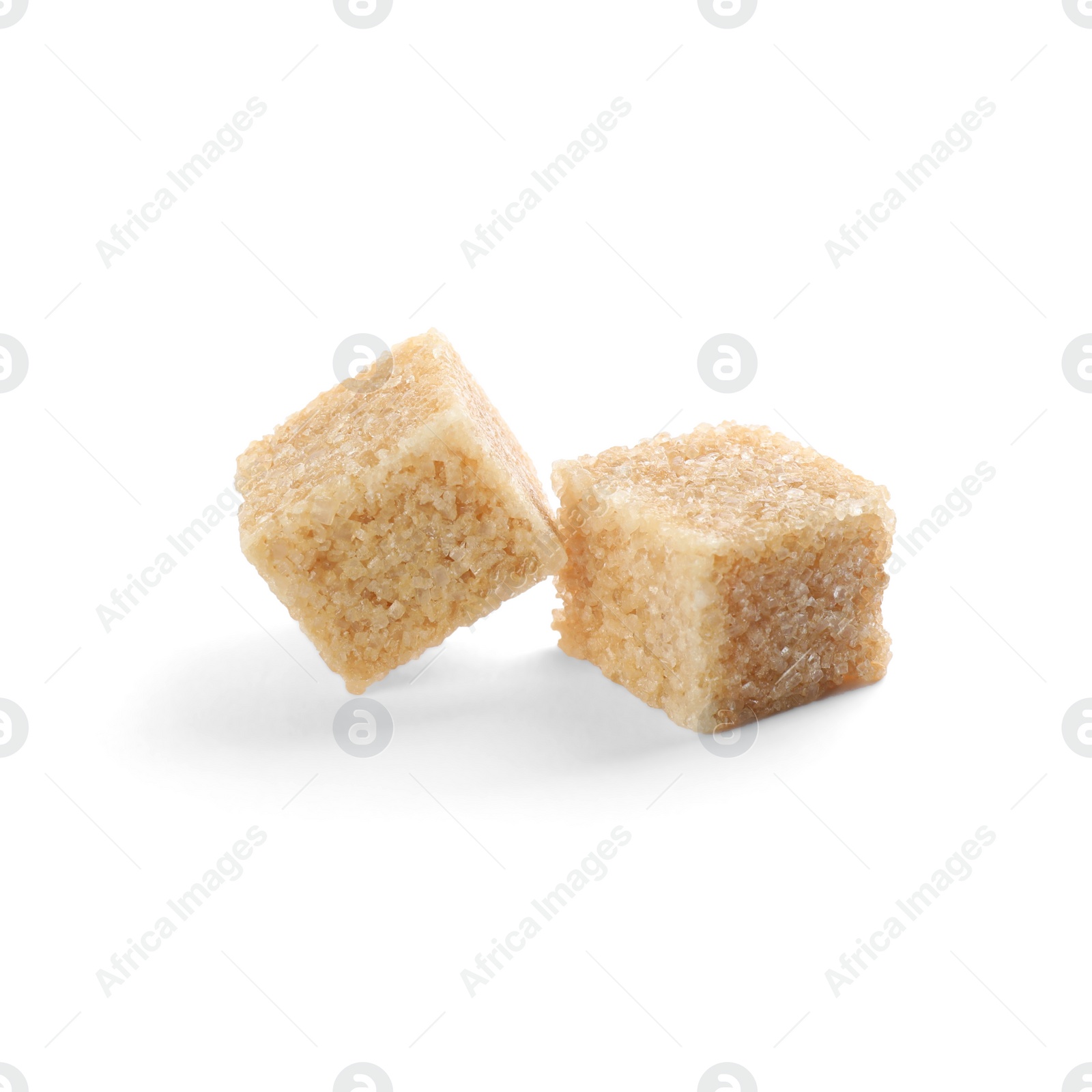 Photo of Two brown sugar cubes isolated on white