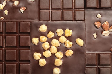 Different delicious black chocolate bars as background