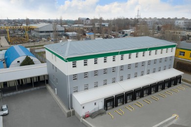 Image of Aerial view of warehouse with loading docks outdoors. Logistics center
