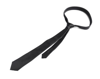 Photo of One black necktie isolated on white, above view