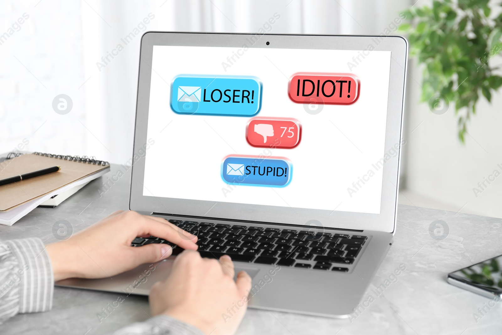 Image of Young woman using laptop at white marble table, closeup. Cyber bullying