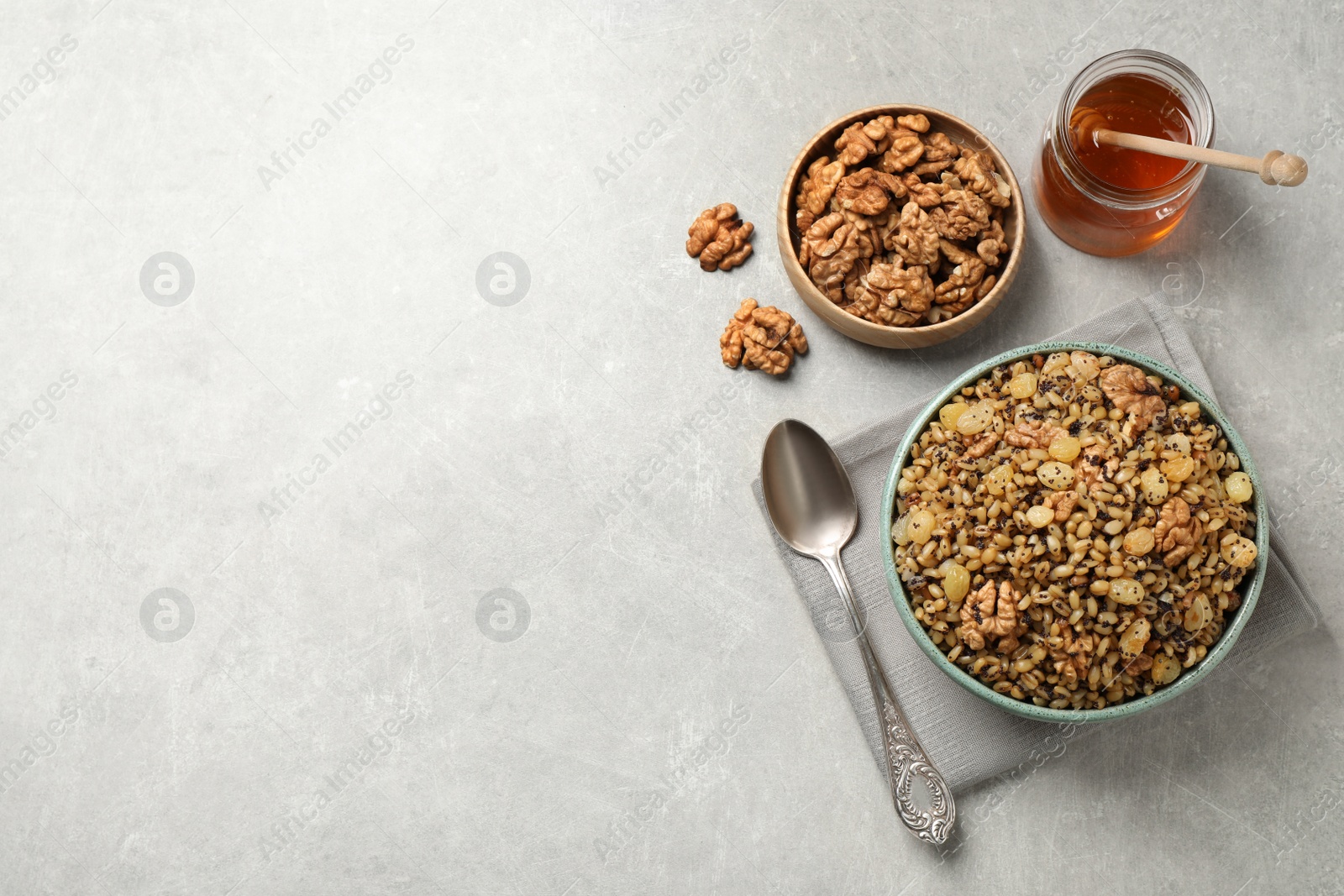 Photo of Traditional Christmas slavic dish kutia served on light grey table, flat lay. Space for text