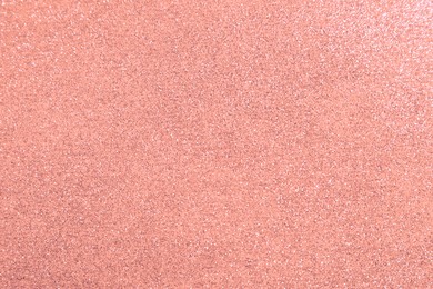 Beautiful pink shiny glitter as background, top view