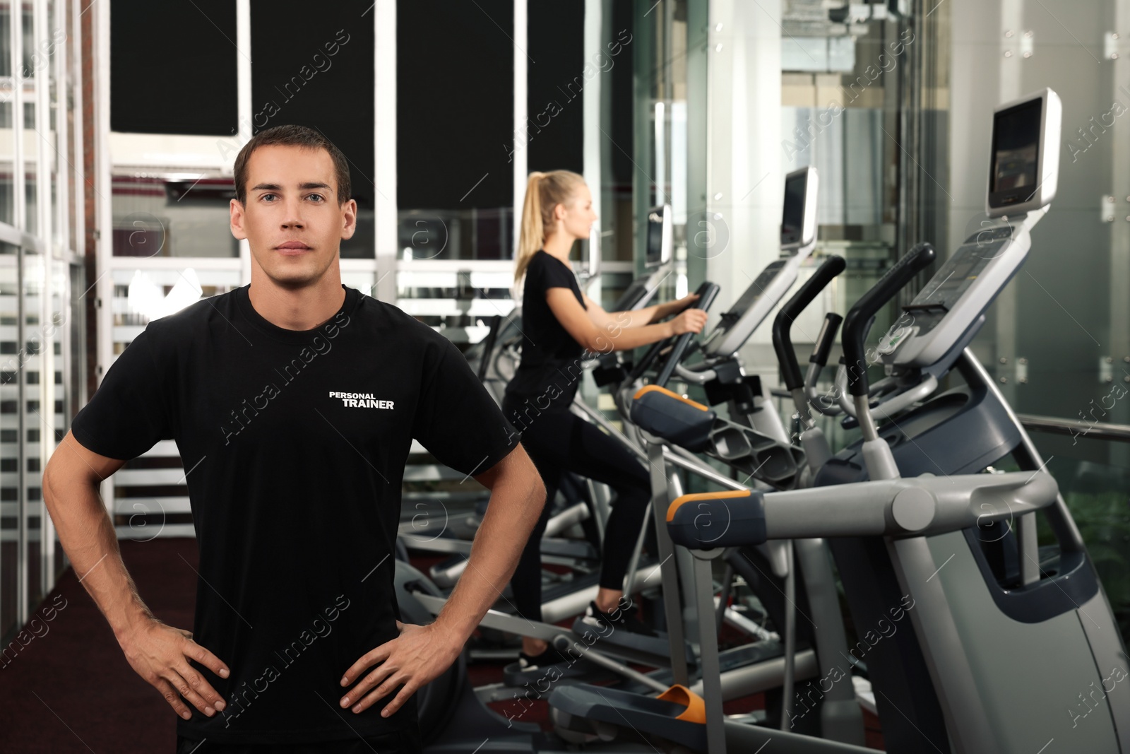 Photo of Portrait of personal trainer in modern gym