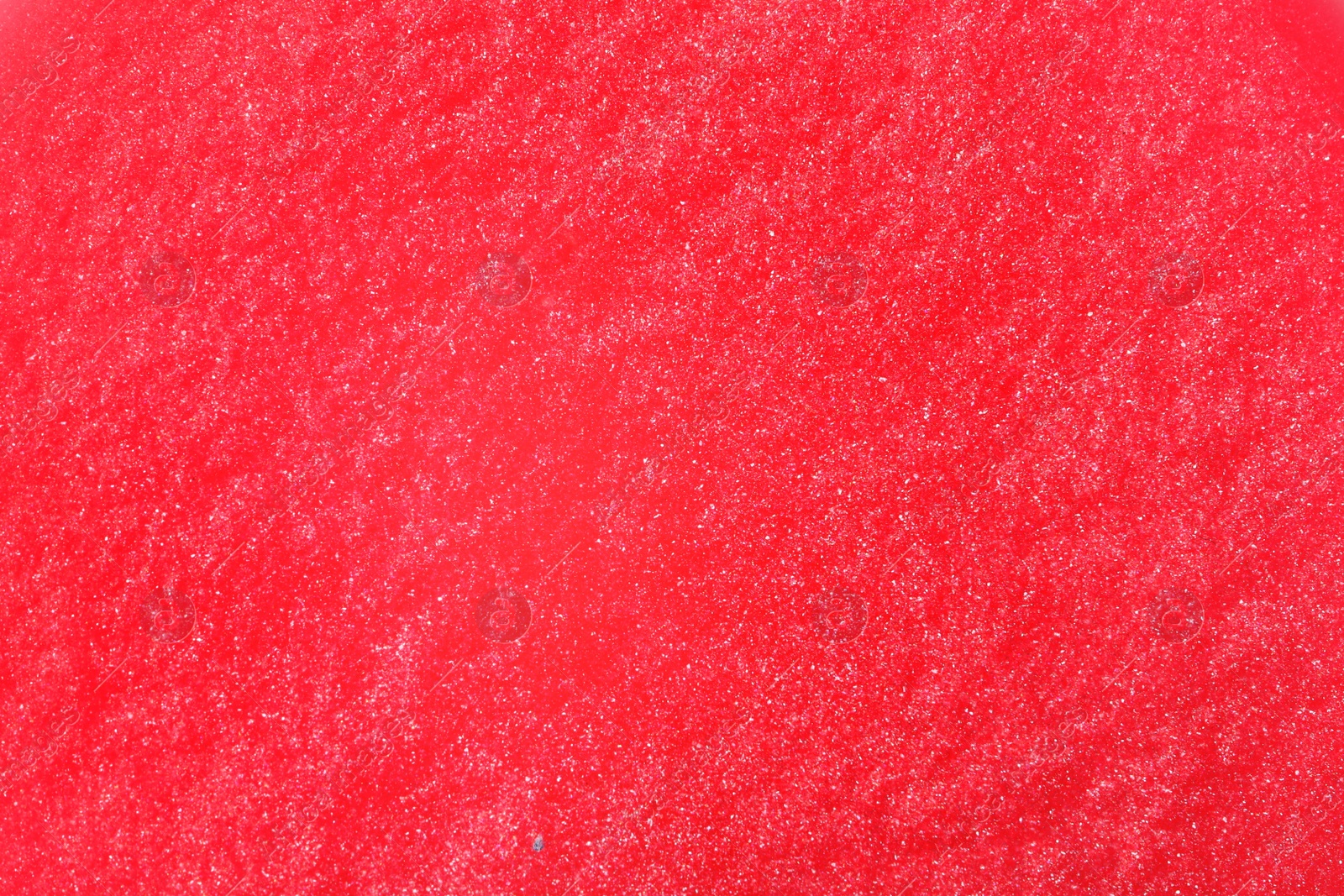 Photo of Closeup view of pink slime as background. Antistress toy