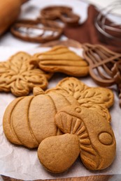Photo of Tasty cookies and cutters on table, closeup