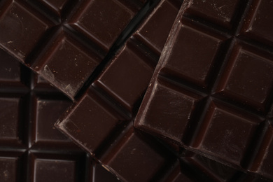 Photo of Delicious dark chocolate as background, closeup view