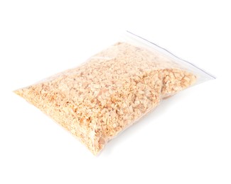 Photo of Natural sawdust in zip bag isolated on white