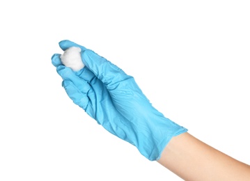 Photo of Doctor in sterile glove holding medical cotton ball on white background