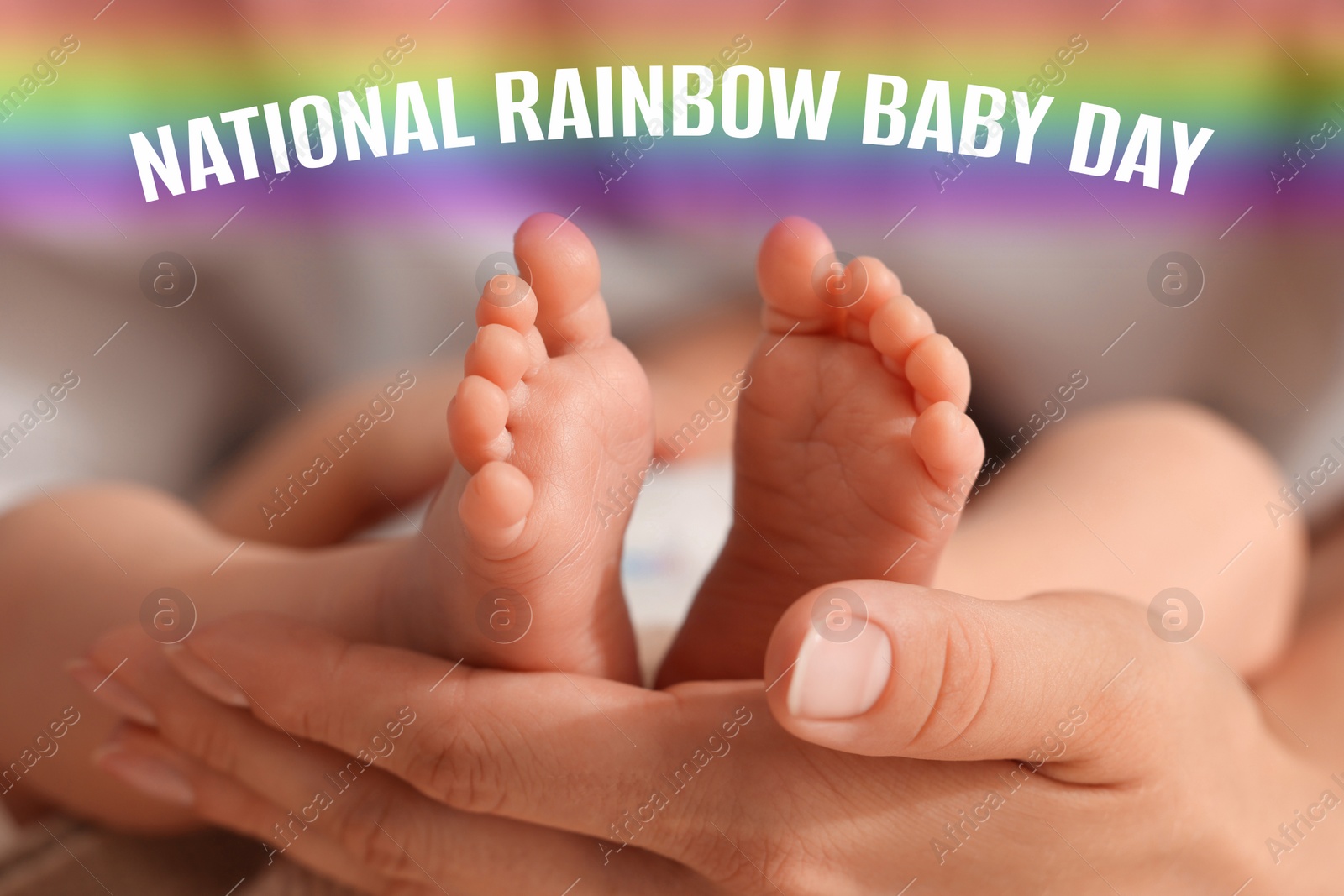 Image of National rainbow baby day. Mother holding her little child, closeup view on feet