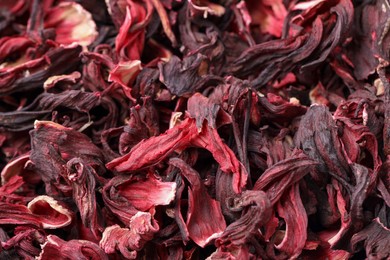 Photo of Dry hibiscus tea as background, closeup view