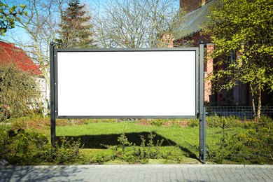 Image of Empty signboard outdoors on sunny day. Mock-up for design