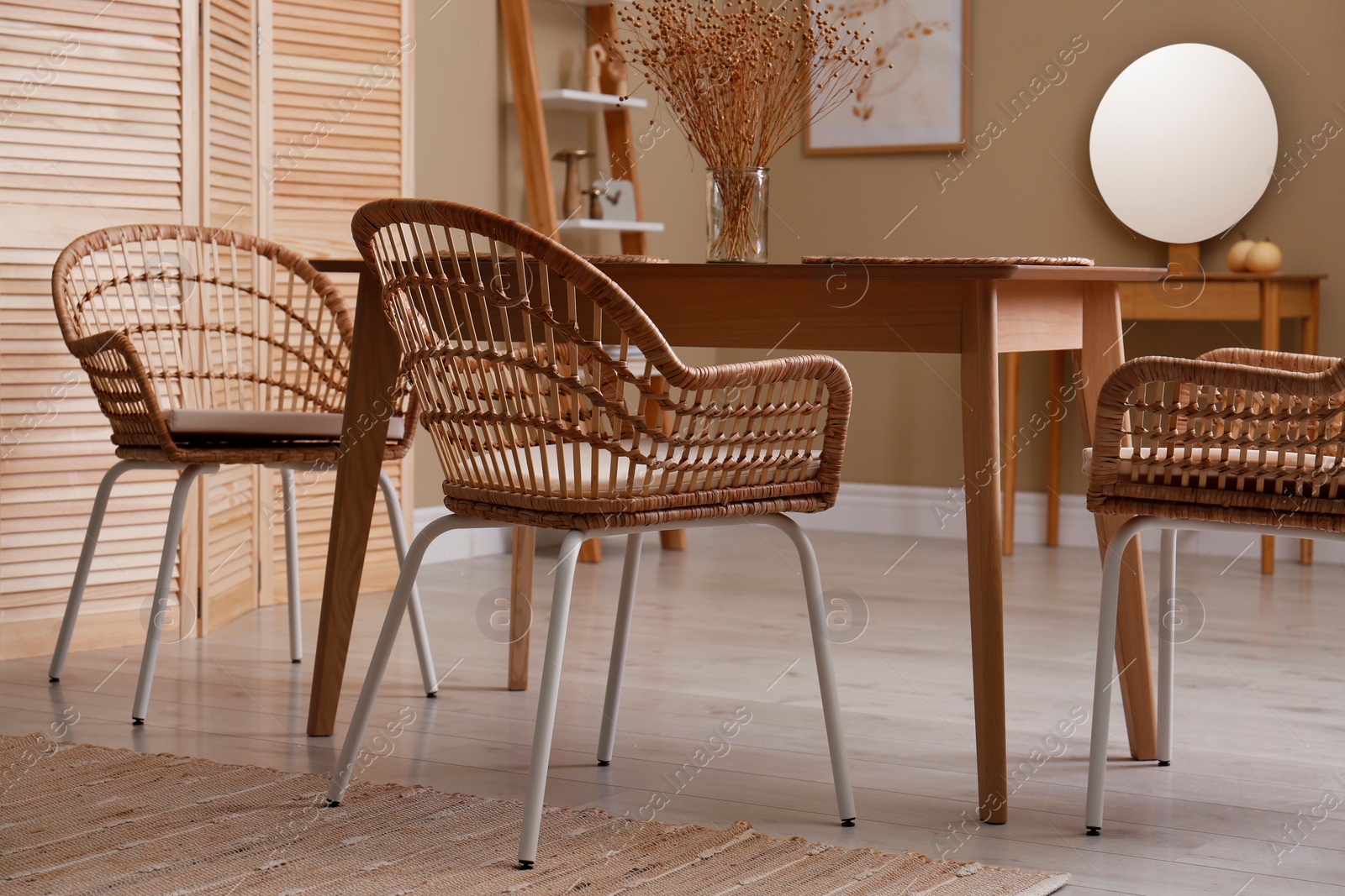 Photo of Beautiful dining room interior with new stylish furniture