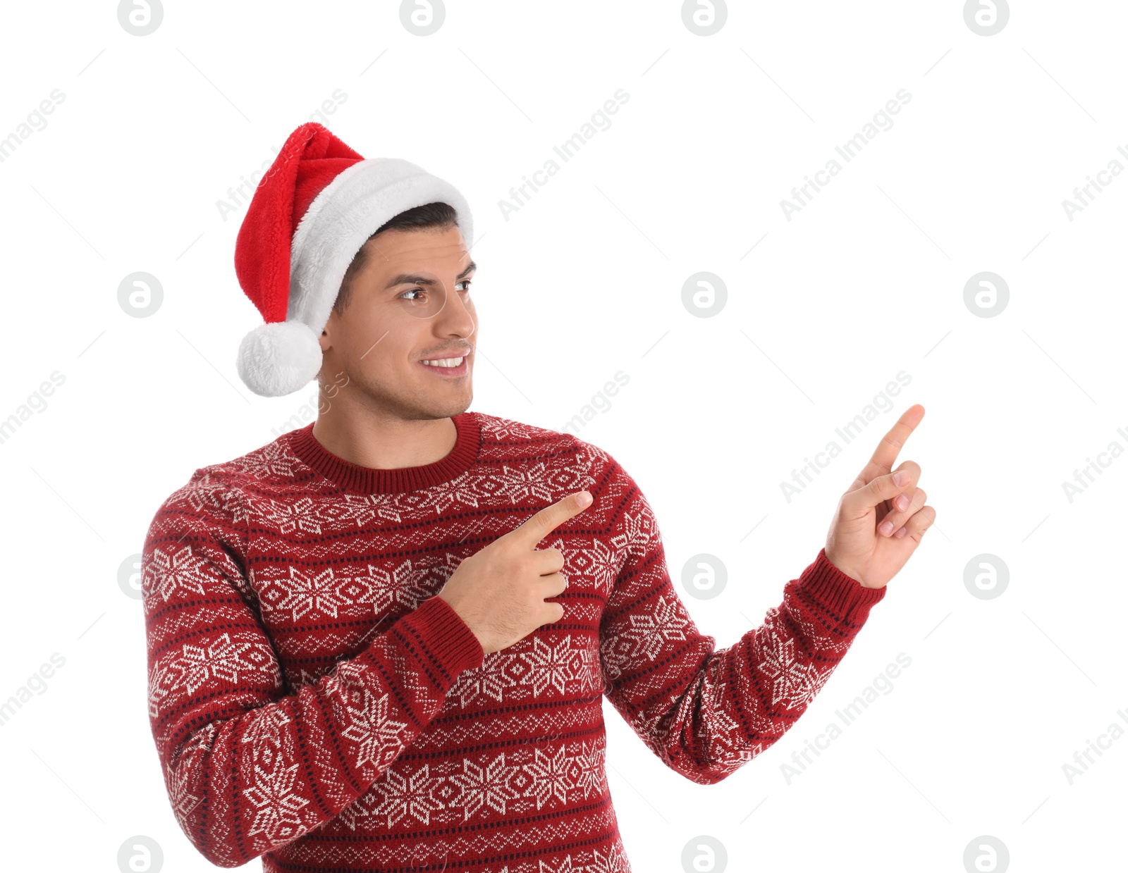 Photo of Handsome man wearing Santa hat on white background