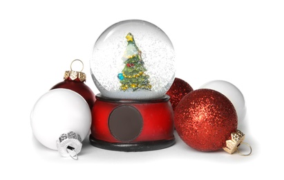 Magical snow globe with Christmas balls on white background