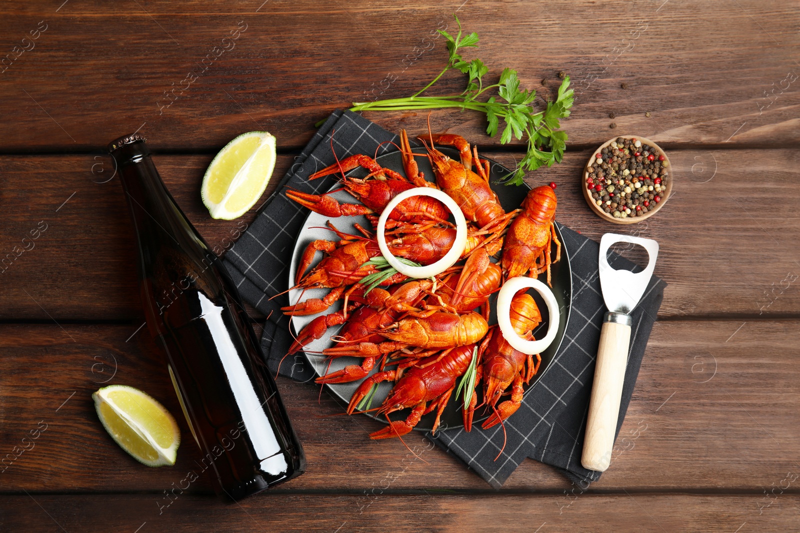 Photo of Flat lay composition with delicious red boiled crayfishes on wooden table