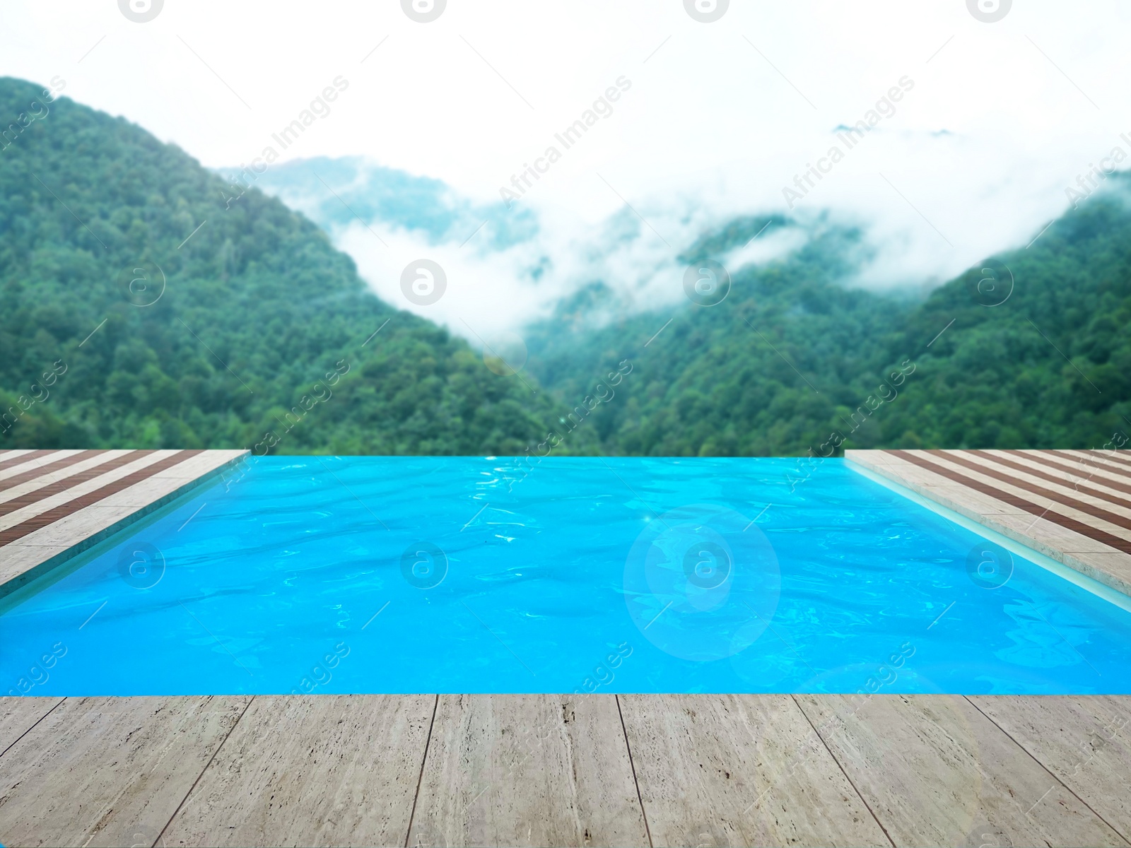 Image of Outdoor swimming pool at luxury resort with beautiful view of mountains